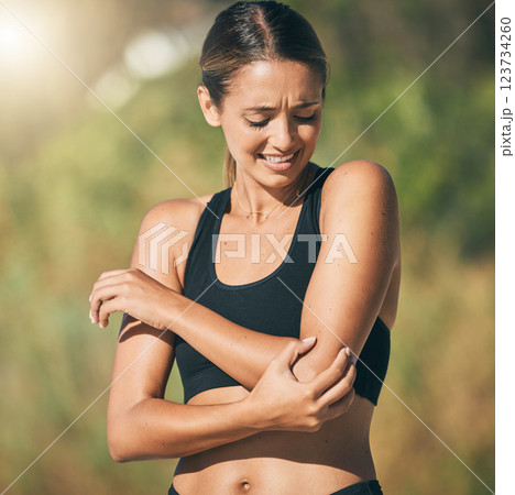 Fitness, woman and elbow in pain, injury or sports accident of runner suffering in joint ache outdoors. Athletic female holding painful area of muscle, inflammation or broken bone in discomfort 123734260