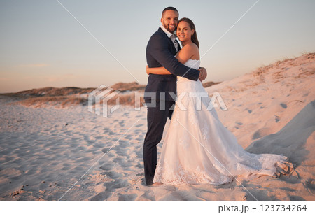 Wedding, couple and bride with groom at a beach in Cancun, Mexico in celebration of love, trust and marriage. Smile, romance and happy woman hugging her partner enjoying a special day and commitment 123734264