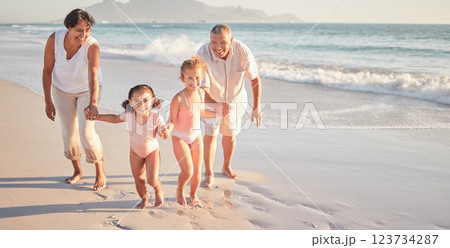 Family beach, summer love and children with smile for holiday at the sea in Mexico with grandparents. Portrait of girl kids running and playing by water on nature vacation with senior man and woman 123734287