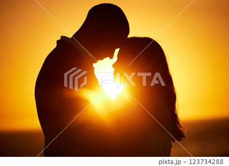 Silhouette, sunset and couple on honeymoon love bonding, hugging and enjoying quality time together in Los Angeles. Romantic woman and partner on holiday vacation in a dark night on Valentines day Silhouette, sunset and couple on honeymoon love bonding, hugging and enjoying quality time together in Los Angeles. Romantic woman and partner on holiday vacation in a dark night on Valentines day 123734288