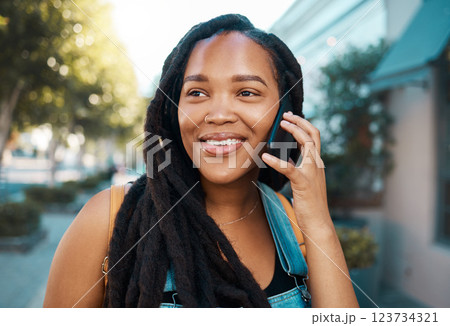 Happy black woman on the street, phone call on smartphone and talking on the pavement outside in the city. Smiling african american student, 5g mobile communication and connection for road directions 123734321