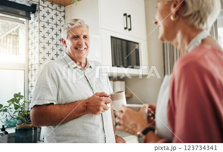 Senior man, drinking coffee and conversation with woman in kitchen at home in New Zealand. Happy, elderly and smile couple enjoy morning tea, chat and relax together in apartment for retirement break 123734341