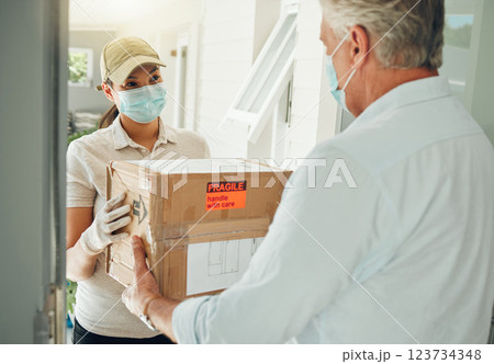 Online delivery worker, during covid pandemic does ecommerce box transport to door and with a mask on face. E commerce shopping industry, retail courier shipping service and safe package distribution 123734348