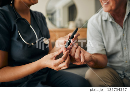 Blood test, doctor consultation and senior man consulting with healthcare nurse about diabetes. Hands of elderly person and hospital worker doing check on sugar with insulin pen on the sofa of home 123734357