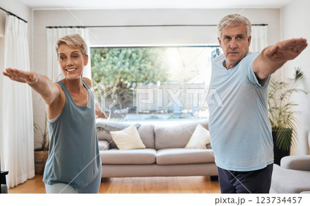 Yoga, workout and senior couple doing exercise in their home to keep active. Old woman and man doing fitness training in their living room. Healthy lifestyle, wellness and stretching after retirement 123734457