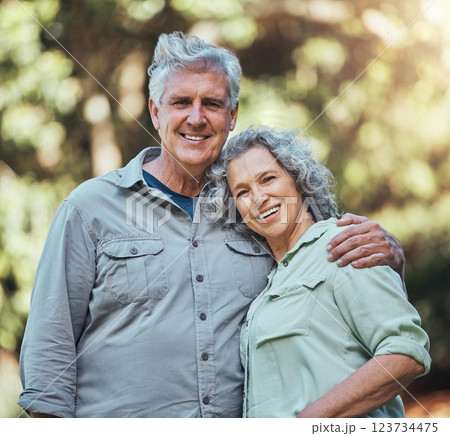 Senior couple, love and hug in nature together for support, care and smile in outdoor park. Portrait of joy, happiness and elderly man and woman happy in retirement, romance and quality time outside 123734475