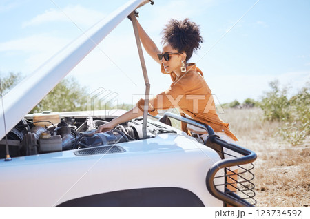 Black woman car engine problem on road trip or outdoor holiday travel journey in Africa. Girl driver stop traveling, vacation and accident emergency assistance try fix or repair motor transportation 123734592