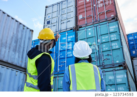 Logistics, shipping and manager planning container export with employee in an export delivery industry. Industrial workers working with stock or cargo transport at a international and global trade 123734593