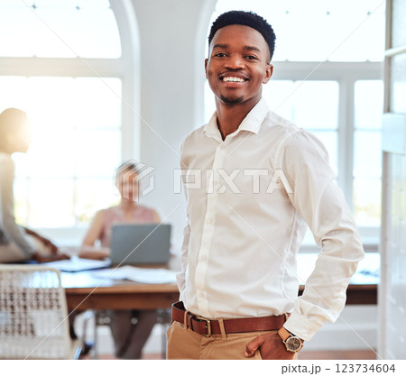 Black man, business and portrait of leader in a meeting with a smile for success and proud leadership at the office. Happy and confident African American male manager smiling for team conference 123734604