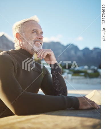 Surf, happy and surfboard mature man at beach for fitness and adventure on summer tropical Hawaii vacation. Sport person, retirement and healthy lifestyle motivation, surfing and water sport in sun. 123734610
