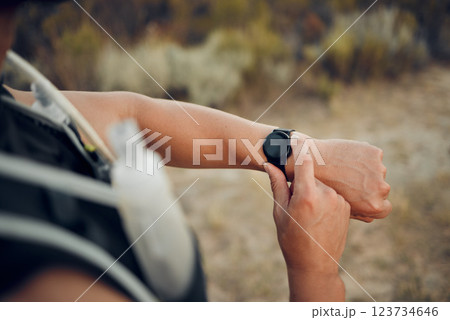Man, hiking and nature with smartwatch for time on run, workout or race for sport. Technology, fitness and exercise for training, wellness and health on adventure with tech, gps or clock in Bogota 123734646