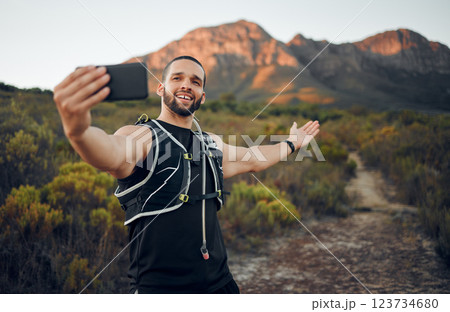 Selfie, athlete and man with smartphone in nature on trail smile, happy and healthy doing exercise and workout. Fitness influencer, health or wellness outdoor calm, peaceful or while training outdoor 123734680