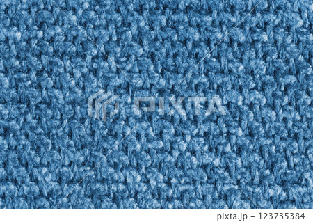 Texture of blue jacquard fabric of rough weave structure close up, macro, background Texture of blue jacquard fabric of rough weave structure close up, macro, background 123735384