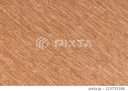 Closeup, macro of orange fabric texture background. Satin diagonal weaving cloth structure, canvas Closeup, macro of orange fabric texture background. Satin diagonal weaving cloth structure, canvas 123735386