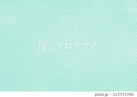 Texture of genuine leather or artificial synthetic leatherette pastel turquoise color background 123735390