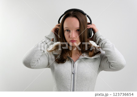 Young happy fun latin woman wear light shirt casual clothes yellow headphones listen to music dance gesticulating hands isolated on plaint pastel purple background studio portrait. Lifestyle concept 123736654