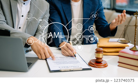 AML Anti Money Laundering Financial Bank Business Concept. judge in a courtroom using laptop and tablet with AML anti money laundering icon 123740375