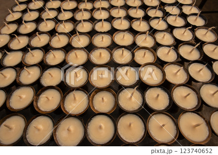 Rows of Beeswax candle in Buddhist temple in Kathmandu, Nepal. The symbolism of a lighted candle has become established in many festivals and religions. 123740652