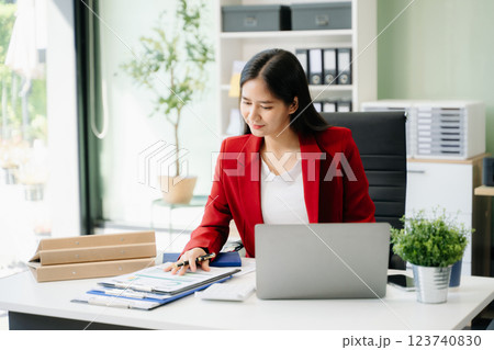Business woman using tablet and laptop for doing math finance on an office desk, tax, Business woman using tablet and laptop for doing math finance on an office desk, tax, 123740830