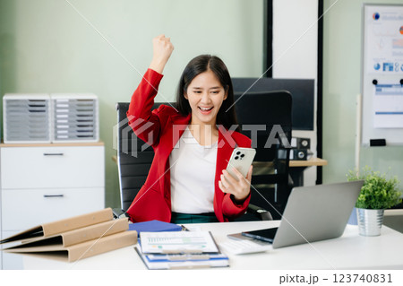 Business woman using tablet and laptop for doing math finance on an office desk, tax, 123740831