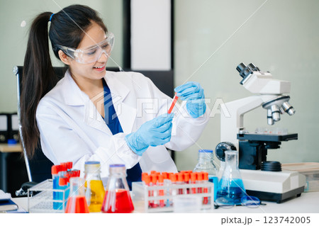 Scientists, beakers, and microscopes in cutting-edge research. Perfect for science and technology projects. Scientists, beakers, and microscopes in cutting-edge research. Perfect for science and technology projects. 123742005