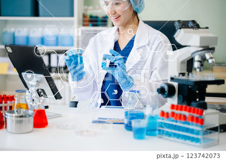 DNA molecule testing concepts. The doctor in a mask examines DNA molecules on the chemical laboratory 123742073