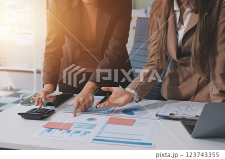 Accounting company provide finance and taxation planning for profitable cash flow, Auditor and accountant team working in office, analyze financial data and accounting record with calculator.Insight Accounting company provide finance and taxation planning for profitable cash flow, Auditor and accountant team working in office, analyze financial data and accounting record with calculator.Insight 123743355