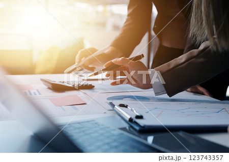 Accounting company provide finance and taxation planning for profitable cash flow, Auditor and accountant team working in office, analyze financial data and accounting record with calculator.Insight Accounting company provide finance and taxation planning for profitable cash flow, Auditor and accountant team working in office, analyze financial data and accounting record with calculator.Insight 123743357