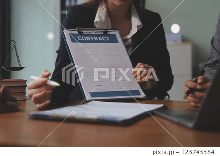 Judge gavel with Justice lawyers having team meeting at law firm background. Concepts of Law and Legal services. Judge gavel with Justice lawyers having team meeting at law firm background. Concepts of Law and Legal services. 123743384