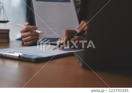 Judge gavel with Justice lawyers having team meeting at law firm background. Concepts of Law and Legal services. Judge gavel with Justice lawyers having team meeting at law firm background. Concepts of Law and Legal services. 123743385