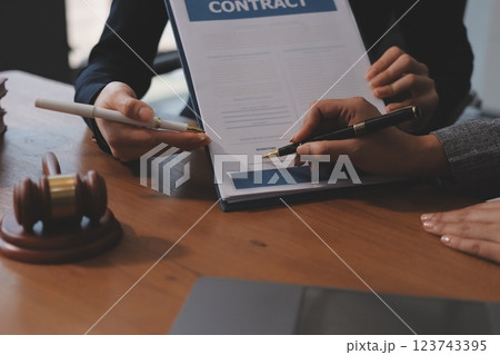 Judge gavel with Justice lawyers having team meeting at law firm background. Concepts of Law and Legal services. 123743395