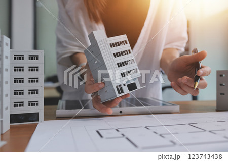 Discussion among businesspeople on the latest developments in solar cell panel technology and Solar Energy Environment city Concept. 123743438