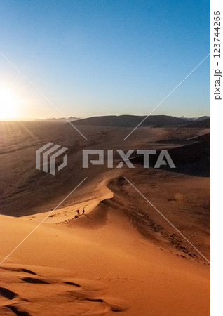 Climbing Dune 45 at sunrise 123744266