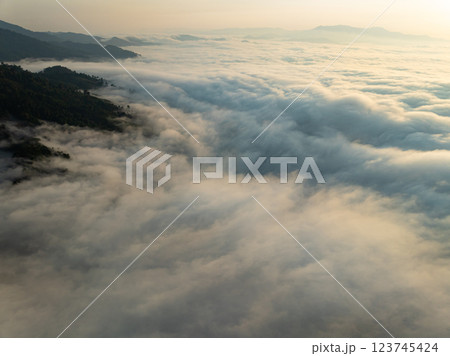 Drone aerial view of landscape fog over mountains in sunrise sky,High angle view over countryside at Southeast asia,Phang Nga Thailand,Wide angle view nature landscape 123745424