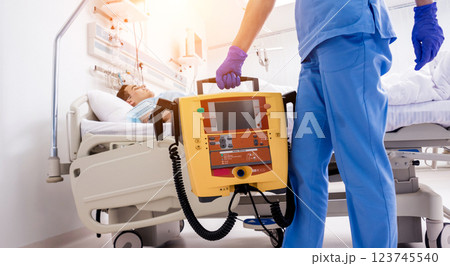 Doctors give resuscitation to a male patient in the emergency room. Doctors give resuscitation to a male patient in the emergency room. 123745540