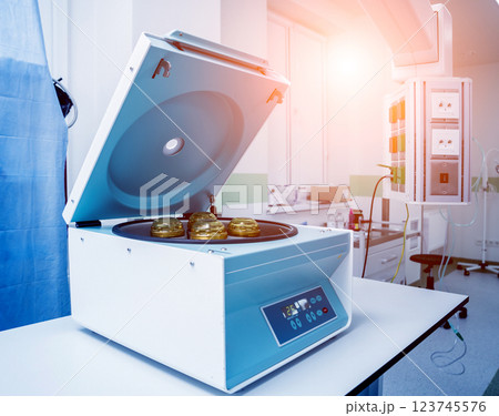 Platelet-Rich plasma preparation. Centrifuge. Modern medical background Platelet-Rich plasma preparation. Centrifuge. Modern medical background 123745576