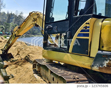 Construction of a modern pedestrian embankment on a large lake 123745606
