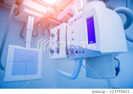 X-ray room in a hospital. Classic ceiling-mounted x-ray system. 123745621