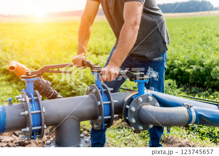 Drip irrigation system. Water saving drip irrigation system being Drip irrigation system. Water saving drip irrigation system being 123745657