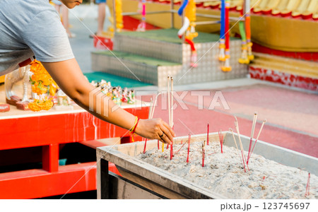 Symbols of Buddhism. Burning incense sticks. South-Eastern Asia.  123745697