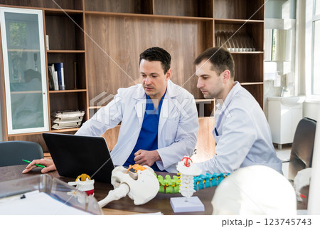Doctors team having medical council in hospital. Discussing medical issues. Doctors team having medical council in hospital. Discussing medical issues. 123745743