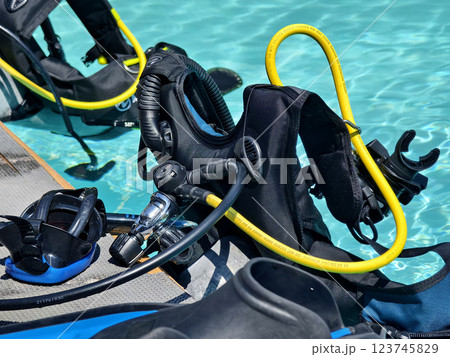 The ready for use scuba divers gear is on the pool edge 123745829