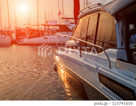 View of harbor with yachts details. Beautiful sunset sky in the marina bay. 123745850