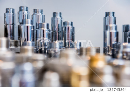 Hosepipe fittings on the table. Plumbing pipeline spare parts. 123745864