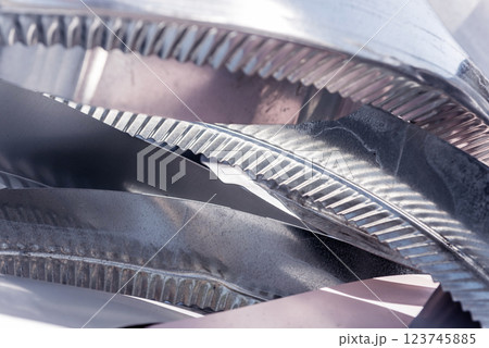 Curved lines of rolled metal are made of sheet steel. 123745885