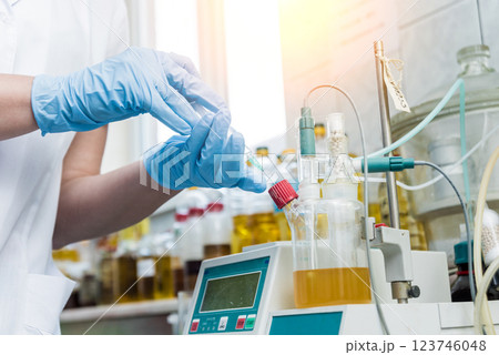 Natural oil quality control. In the industrial laboratory. 123746048