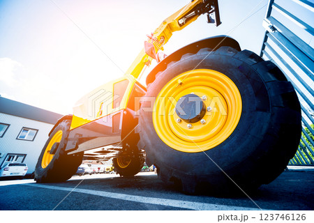 Modern agricultural machinery and equipment. Yellow agricultural harvester. 123746126