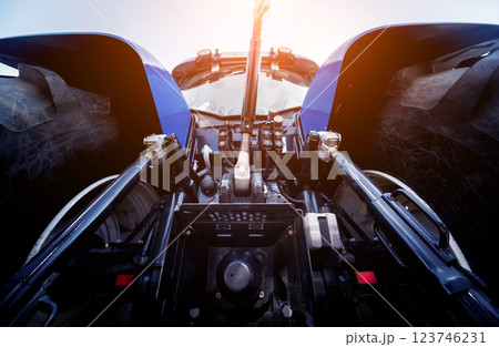Rear view of modern agricultural tractor. Industrial details. Rear view of modern agricultural tractor. Industrial details. 123746231