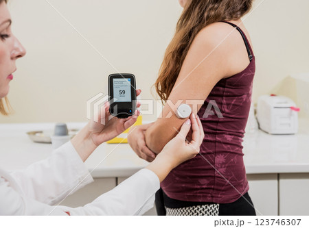 Medical device for glucose check. Continuous glucose monitoring pod. Modern wireless technology. 123746307