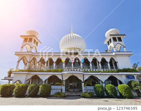 The mosque with the minaret is designed in the Islamic architectural tradition. 123746395